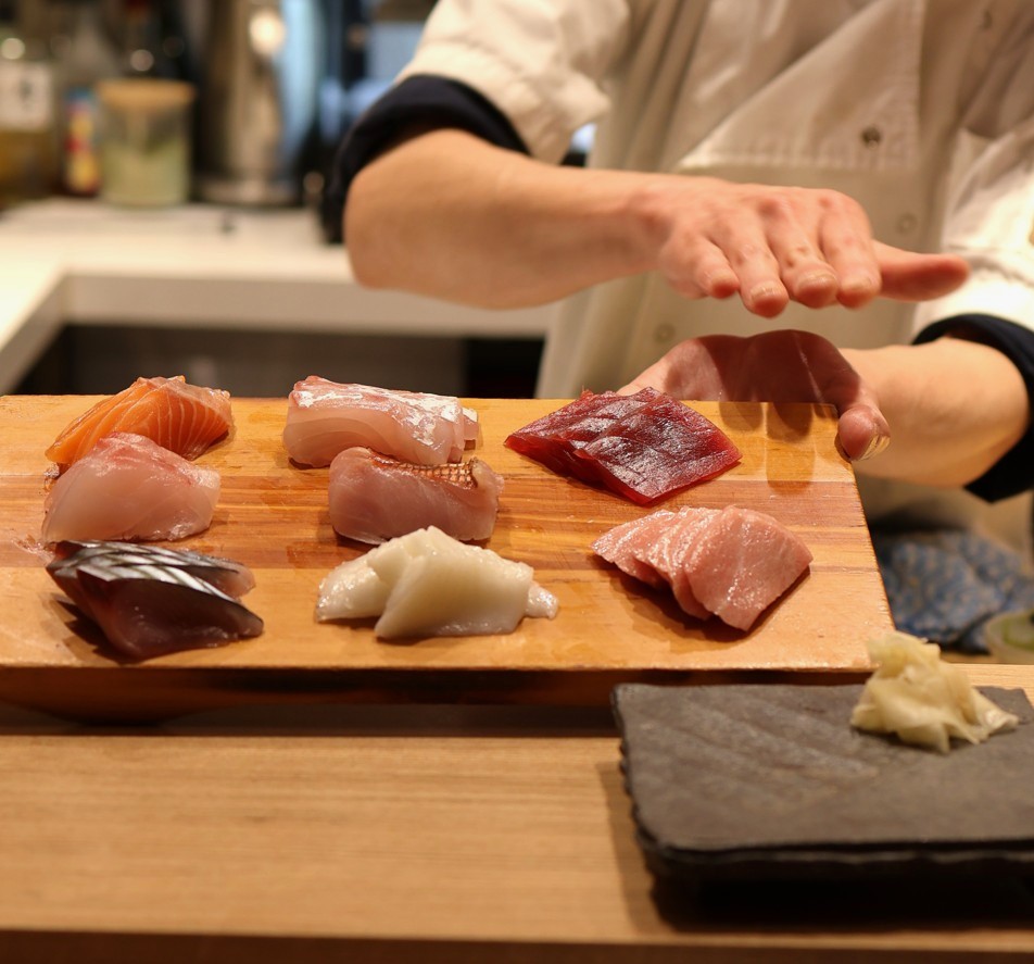 Chef introducing sashimi of the night inside Haymarket Japanese restaurant Sushi Sei